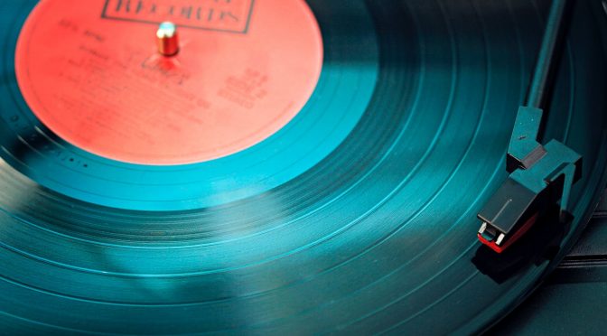 blue vinyl record playing on turntable